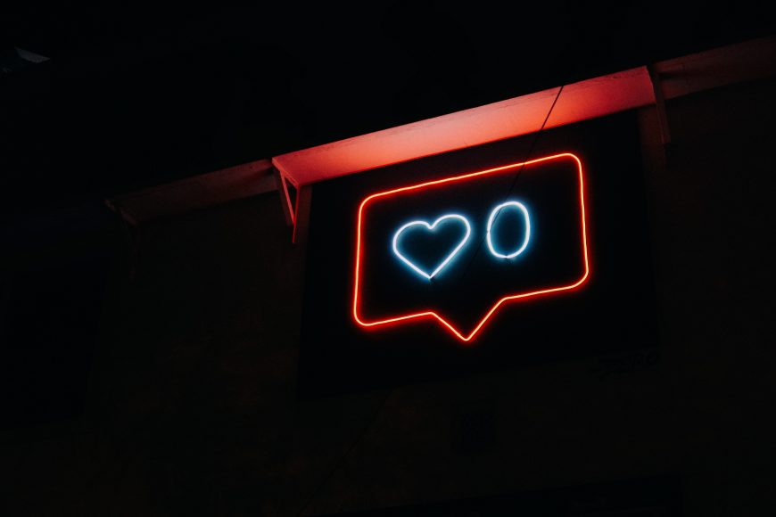 A neon sign illustrating Instagram's like function