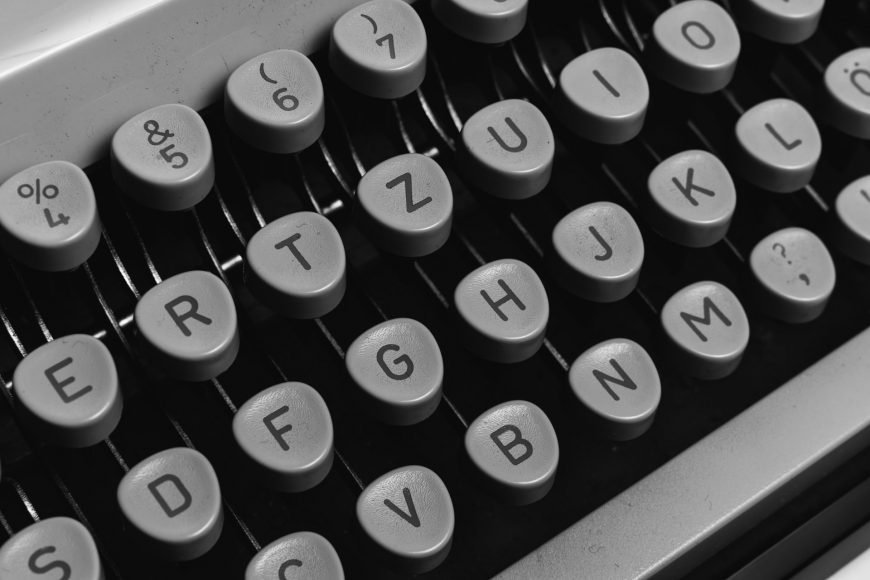 A close-up view of the stylized keyboard of a typewriter.